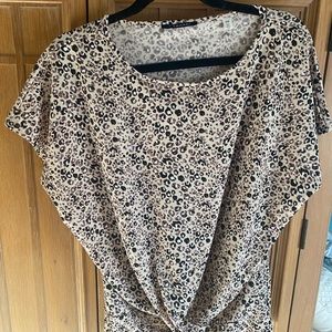 Tahari Size M Top has a very cute leopard or cheetah print. tan and black